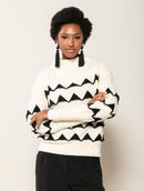 Blusa em padronagem geométrica com gola rolê e mangas da cava quadrada Biamar