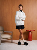 Blusa unissex alongada com zíper na gola e mangas em moletom Biamar