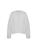 Casaco canelado com botões, bolsos e mangas de cava quadrada abenção