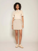 Blusa manga curta em algodão com gola polo e abertura nas costas Biamar