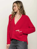 Casaco canelado com botões, bolsos e mangas de cava quadrada abenção