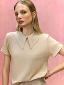 Blusa manga curta em algodão com gola polo e abertura nas costas Biamar