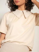 Blusa manga curta em algodão com gola polo e abertura nas costas Biamar