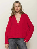 Casaco canelado com botões, bolsos e mangas de cava quadrada abenção