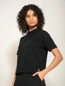 Blusa manga curta em algodão com gola polo e abertura nas costas Biamar