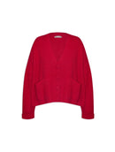 Casaco canelado com botões, bolsos e mangas de cava quadrada abenção